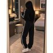 Чорний зимовий спортивний костюм жіночий з флісу Polar Fleece вигляд ззаду штани та кофта з капюшоном